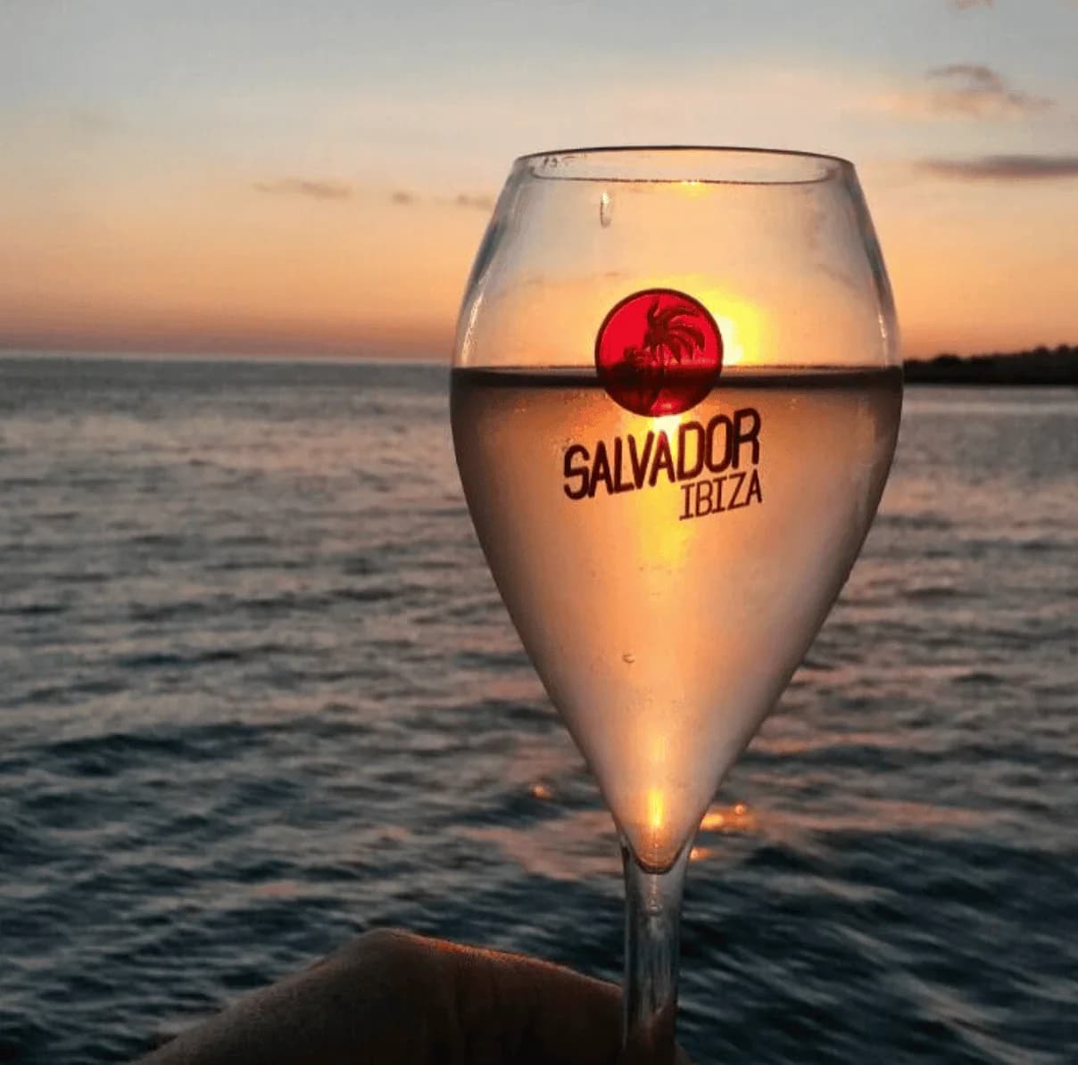 Glass of cava during sunset cruise on Salvador Ibiza