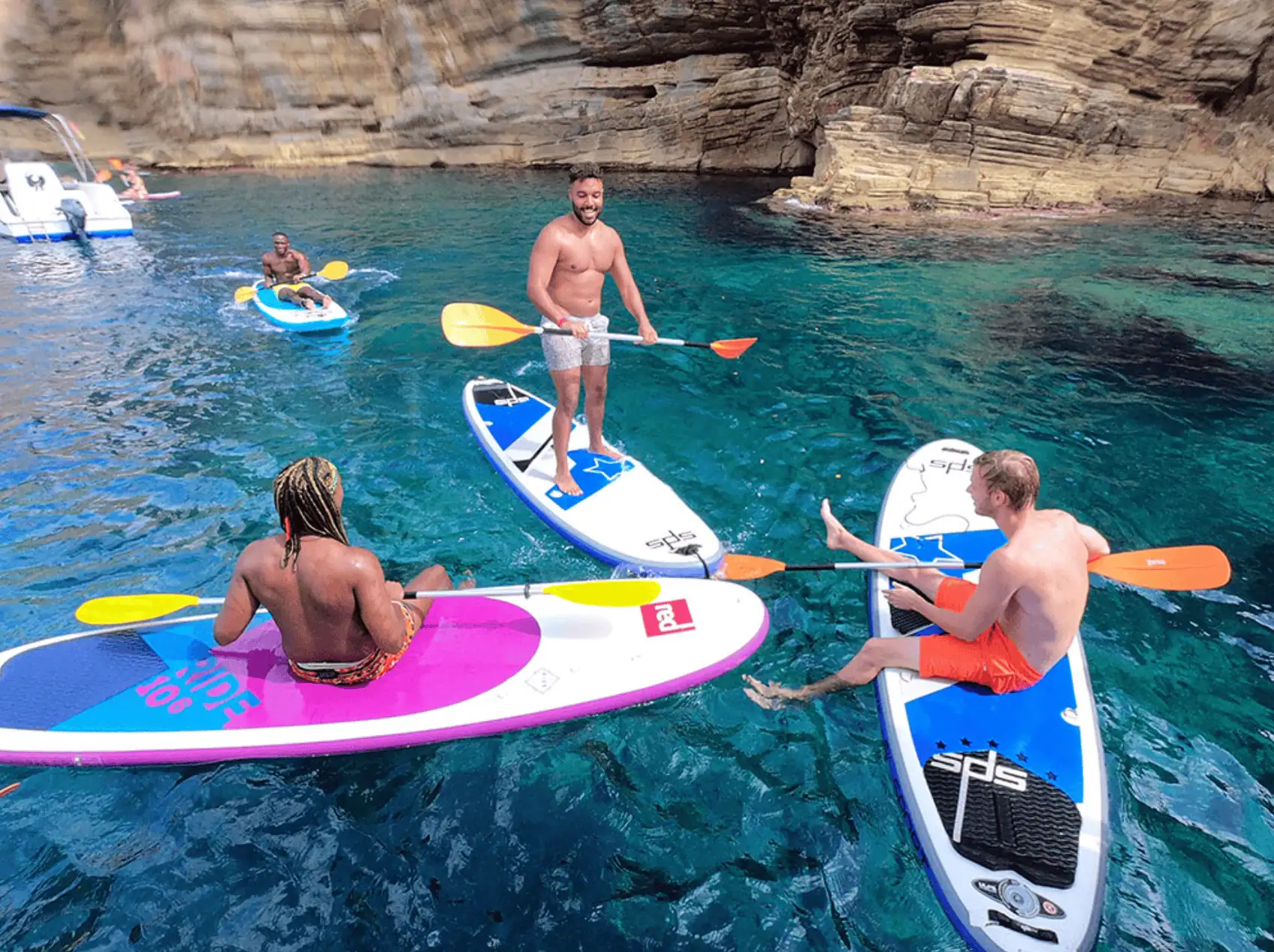 Group paddleboarding in clear water