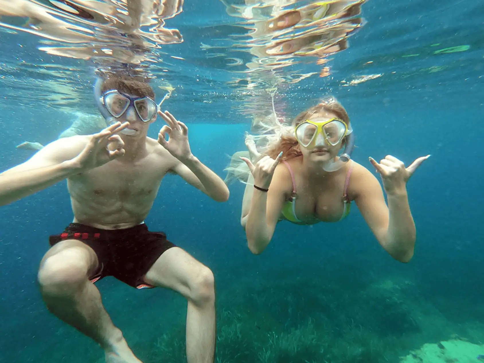 Couple snorkeling in the turquoise sea